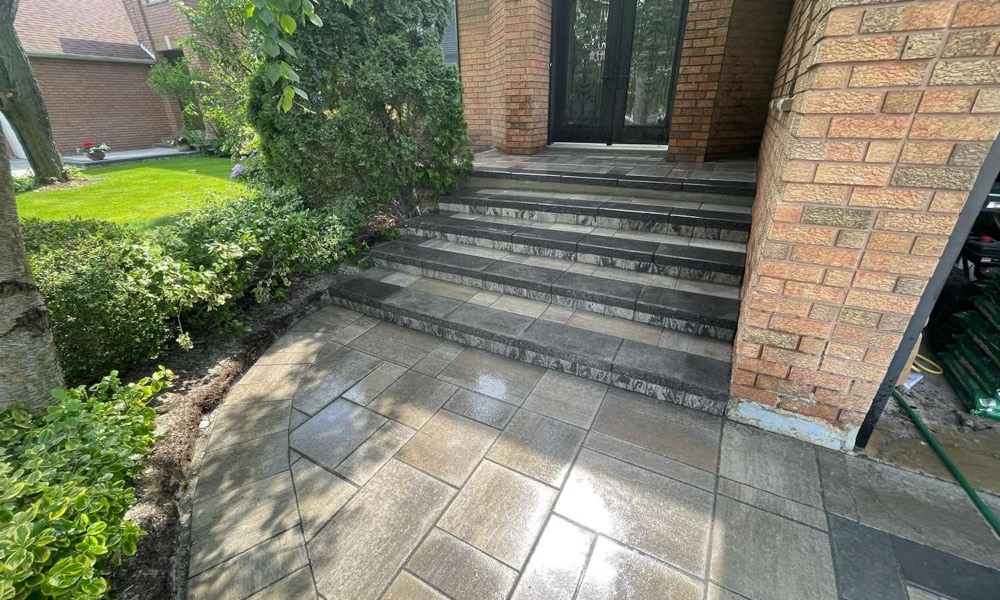 Rebuilt stone front-entrance steps at a Pristine project